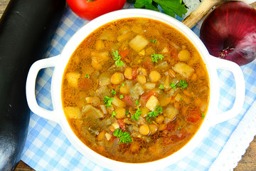 Lentil soup with eggplant, tomatoes and onions