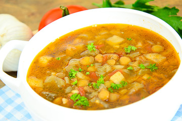 Lentil soup with eggplant, tomatoes and onions