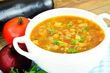 Lentil soup with eggplant, tomatoes and onions