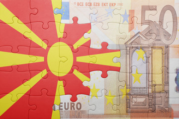puzzle with the national flag of macedonia and euro banknote