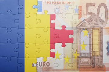 puzzle with the national flag of romania and euro banknote