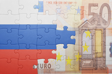 puzzle with the national flag of russia and euro banknote