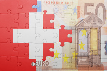 puzzle with the national flag of switzerland and euro banknote