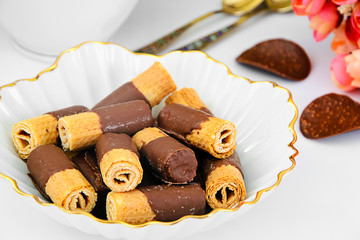 Delicious Cookies with Chocolate on Plate