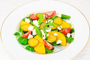 Healthy and Diet Food: Salad, Persimmon, Pickled Cucumber, Tomat