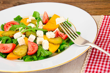Healthy and Diet Food: Salad, Persimmon, Pickled Cucumber, Tomat