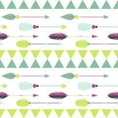 Tribal ethnic arrow seamless pattern. Green, mint and purple arrows and triangles arranged in horizontal rows.