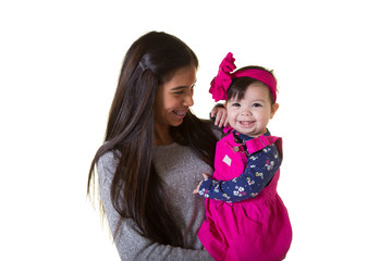 A teenager holding her baby sister