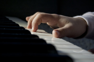 kids hands play piano