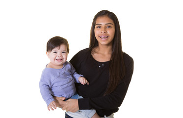 A teenager holding her baby sister