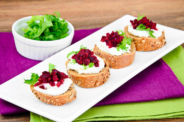 Bruschetta with Goat Cheese, Arugula and Beet, Salt, Pepper, Hon
