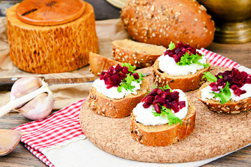 Bruschetta with Goat Cheese, Arugula and Beet, Salt, Pepper, Hon