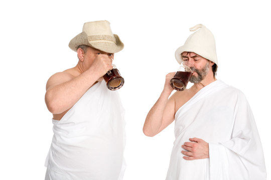 Joyful men drink kvas - russian bread juice. From a series of Russian bath.