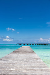 Fototapeta premium Wooden pier on tropical beach