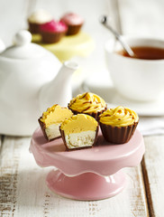 Delicious chocolate candies. Lemon cheesecake cupcake.