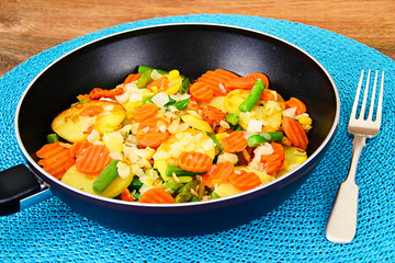 Steamed vegetables potatoes, carrots, corn, green beans, onion