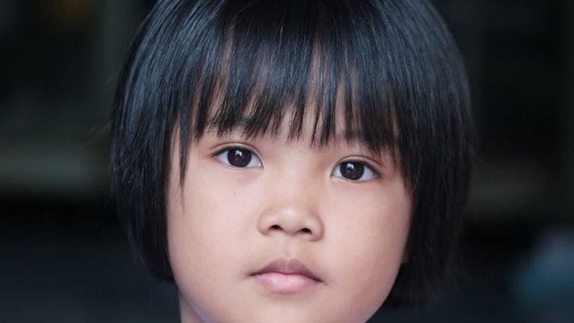 Portrait of asian young lady looking camera