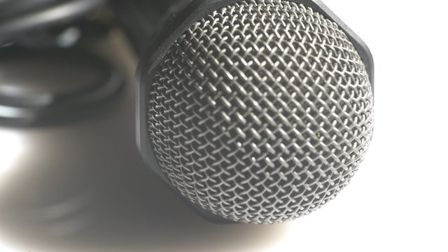 Detailed view of a head of a classic handheld microphone steel grid