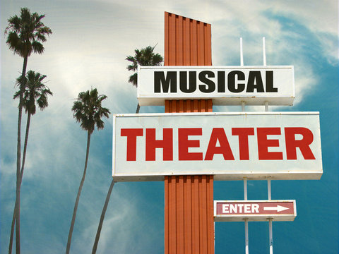 aged and worn musical theater sign with palm trees