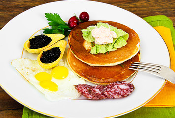 Pancakes with Quail Eggs, Cold Meats, Pastry Spoon with Black Ca
