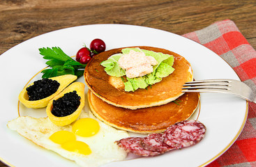 Pancakes with Quail Eggs, Cold Meats, Pastry Spoon with Black Ca