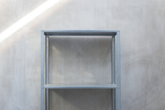 empty  zinc shelf with concrete wall background