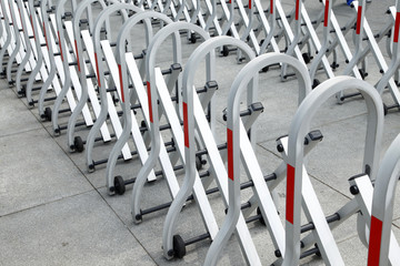 Sliding and folding barrier with wheels