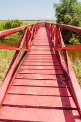 Obraz premium Red wooden bridge at Fort Nieuw Amsterdam in Suriname