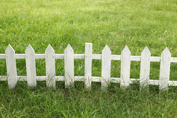 The lawn wooden fence