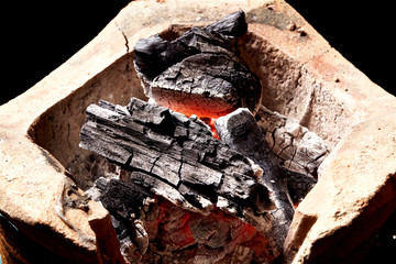 burning charcoal in old stove, thailand tradition