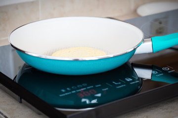 Making home made pancakes on frying pan