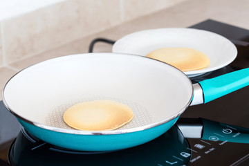 Making home made pancakes on frying pan