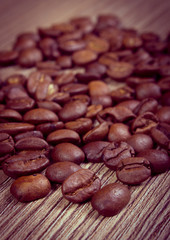 Vintage photo, Heap of coffee on wooden background