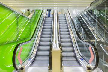 Top view of escalators, green color combination. panoramic angle of escalator