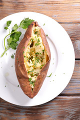 baked potato with cream and herbs