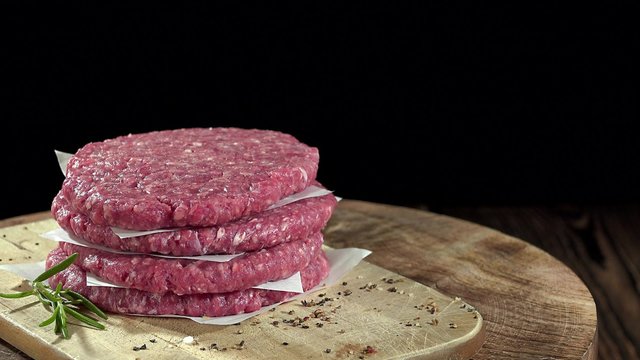Raw Burger Meat (pure beef) as not loopable rotating 4K footage