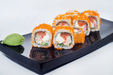 sushi rolls with wasabi and ginger cheese with orange caviar