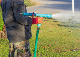 a man watering the garden