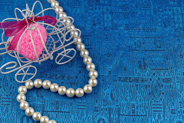Pearl necklace with blue satin background