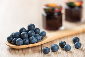 Cooking marmalade: Wooden spoon with blueberries
