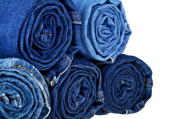 Fototapeta premium Lot of different blue jeans isolated on white background