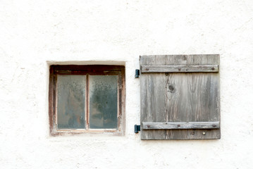 Fototapeta na wymiar Old window and shutter in a Austrian castle wall