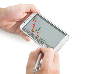 businessman using a mobile device to check stocks and market dat
