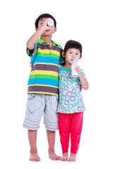 Boy smiling and holding bottle of milk, on white.