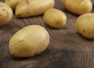 potatoes on a wooden background
