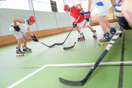 Men Playing Roller Hockey