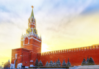  setting sun and fantastic sky above Kremlin wall and Kremlin's Spassky Tower