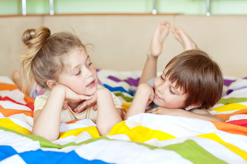 Happy kids in the morning bed  © nuzza11