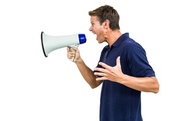 Side view of angry man shouting through megaphone