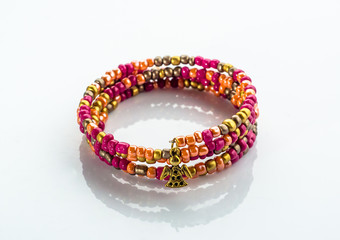 Beautiful bracelet with colorful beads isolated on white background